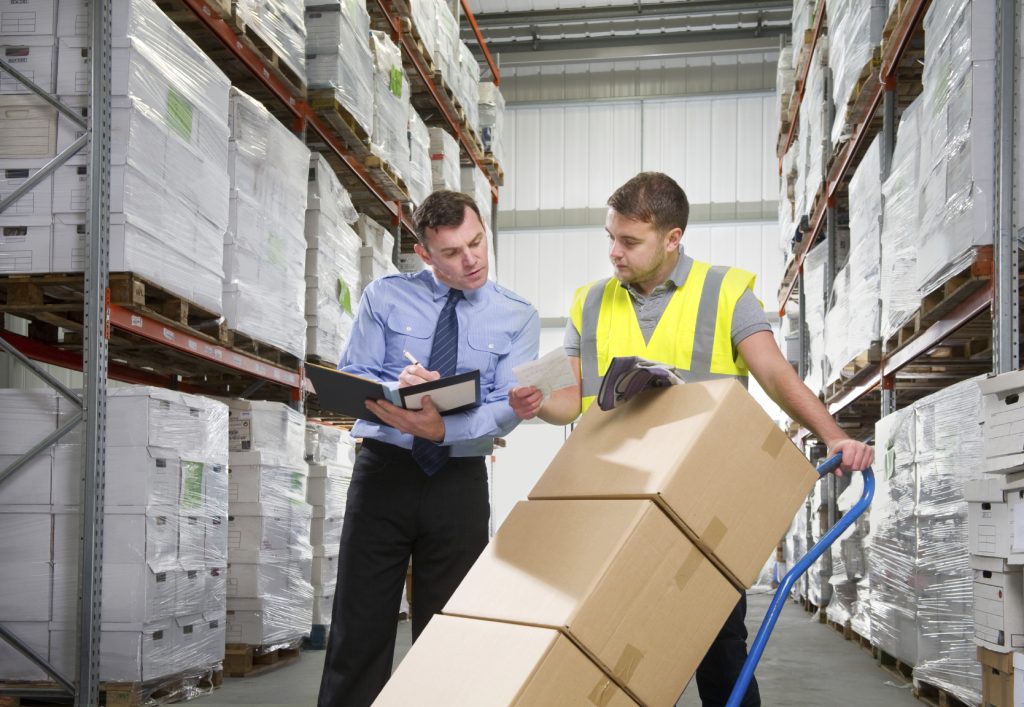 Manager and Worker Moving Warehouse Boxes iStock_000015149219_Medium