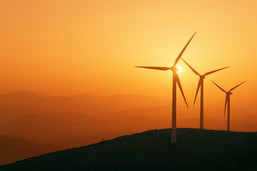 wind turbines in the foreground of sun setting