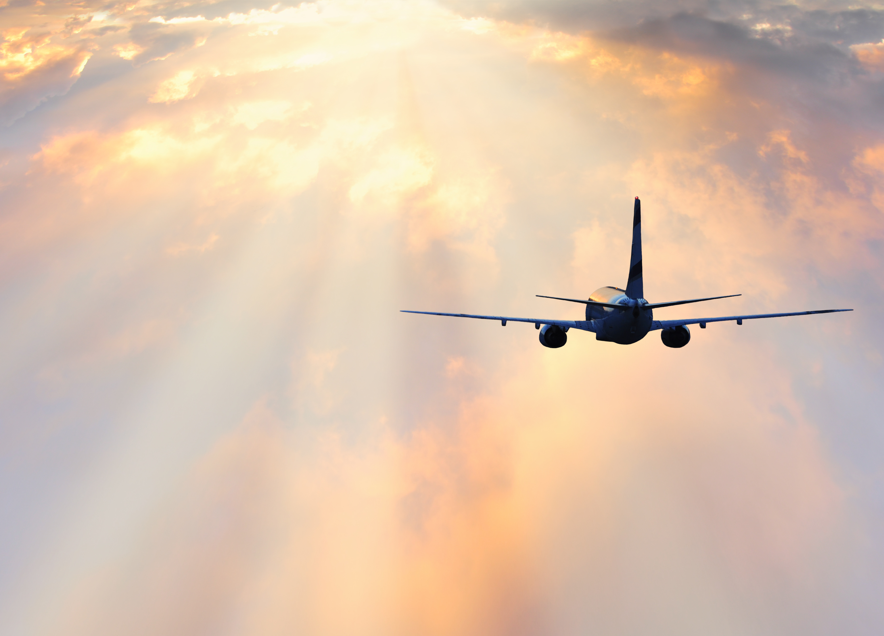 Passenger plane at sunset