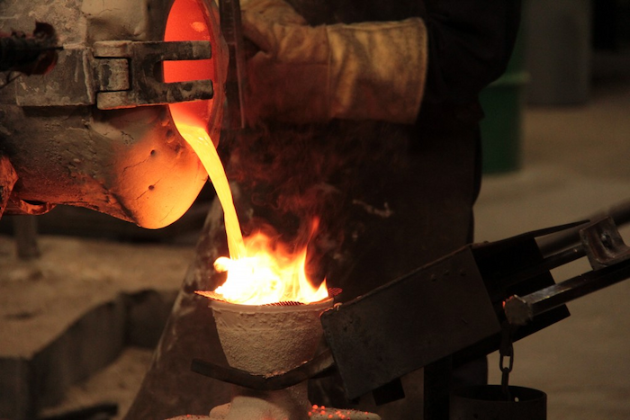 man melting metal