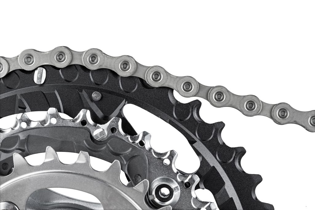 close-up of bicycle crank set with chain isolated on white background