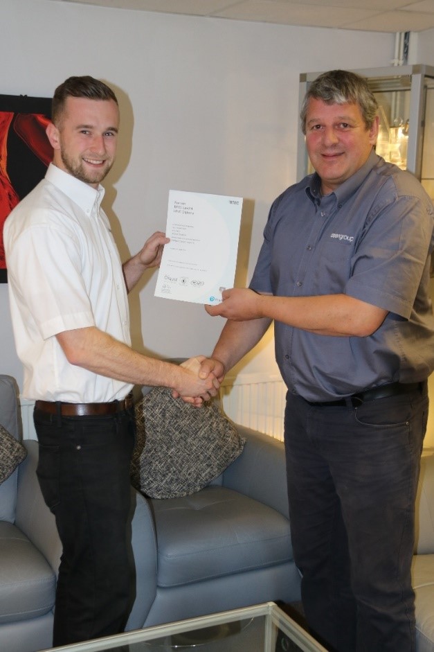 Dean Group apprentice receiving certification