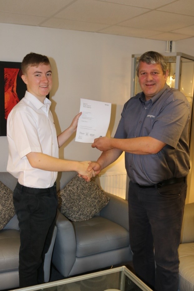 Dean Group apprentice receiving certification