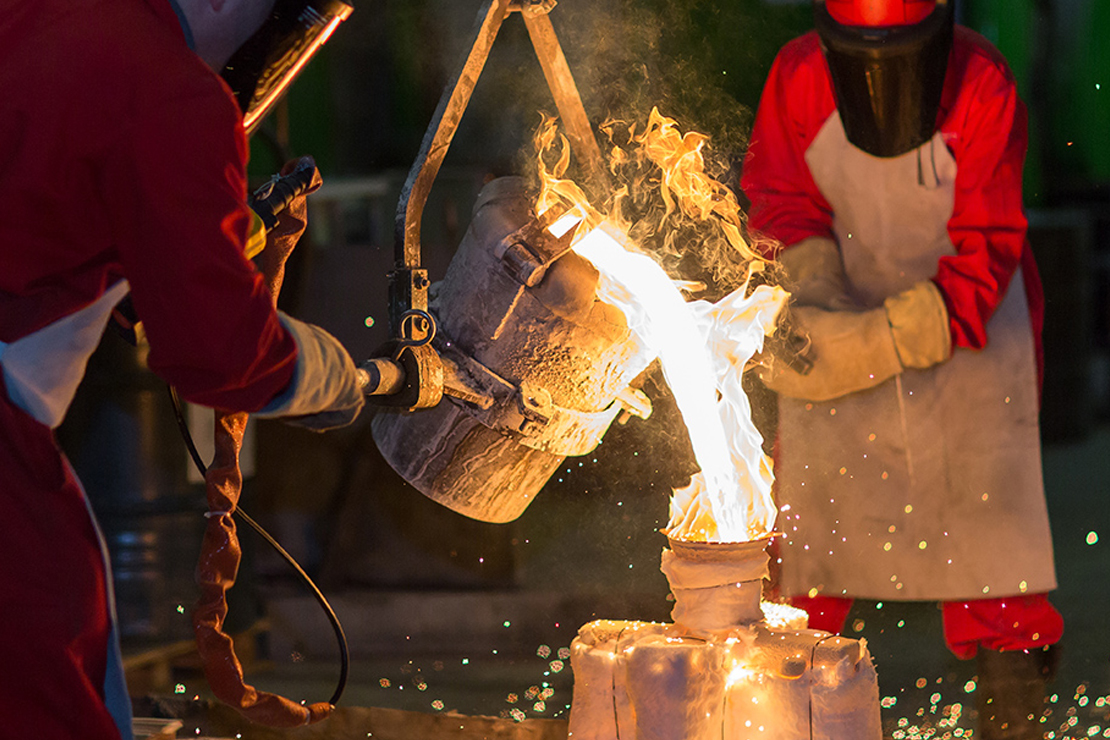 Pouring molten metal into a mould