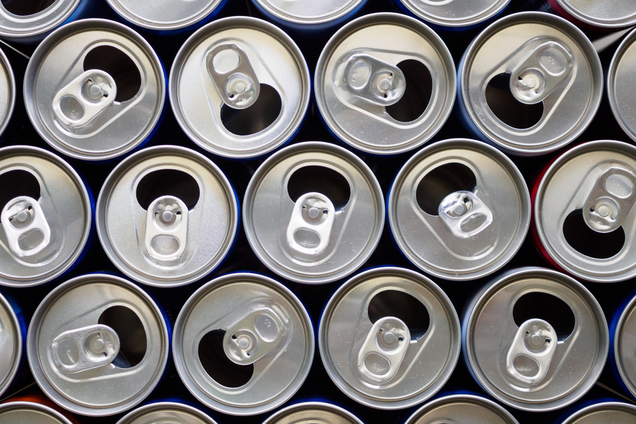 Empty aluminium drink cans recycling background concept