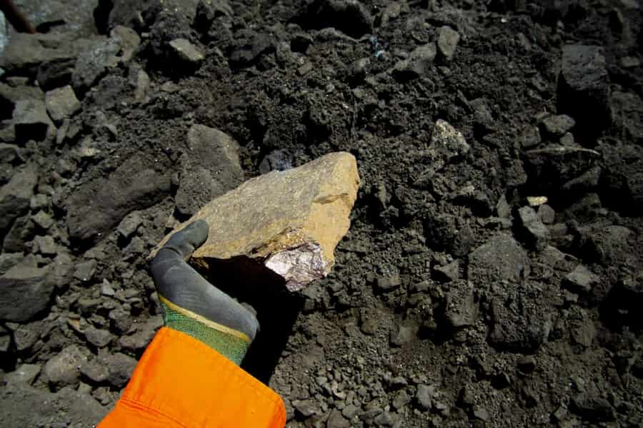 man holding nickel